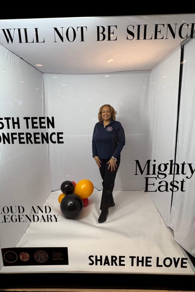 a sleek modern office space is illuminated by vibrant artificial lighting, showcasing a dynamic team meeting at a polished conference table with bold creative presentations displayed on a large digital screen.